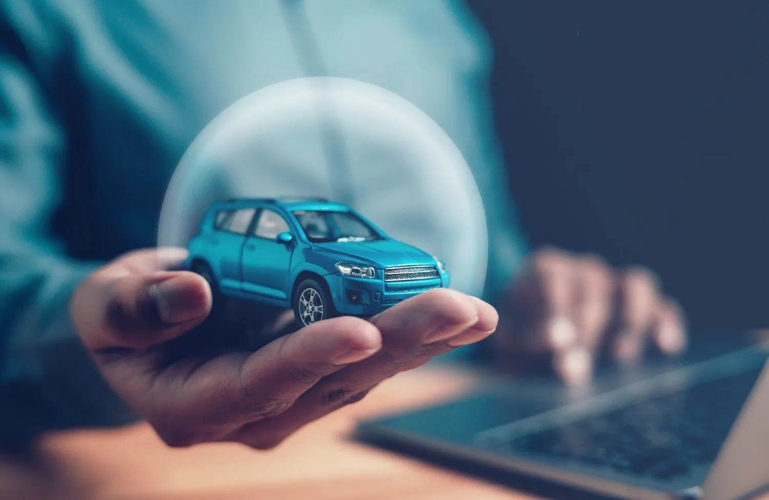 Two people reviewing auto insurance options